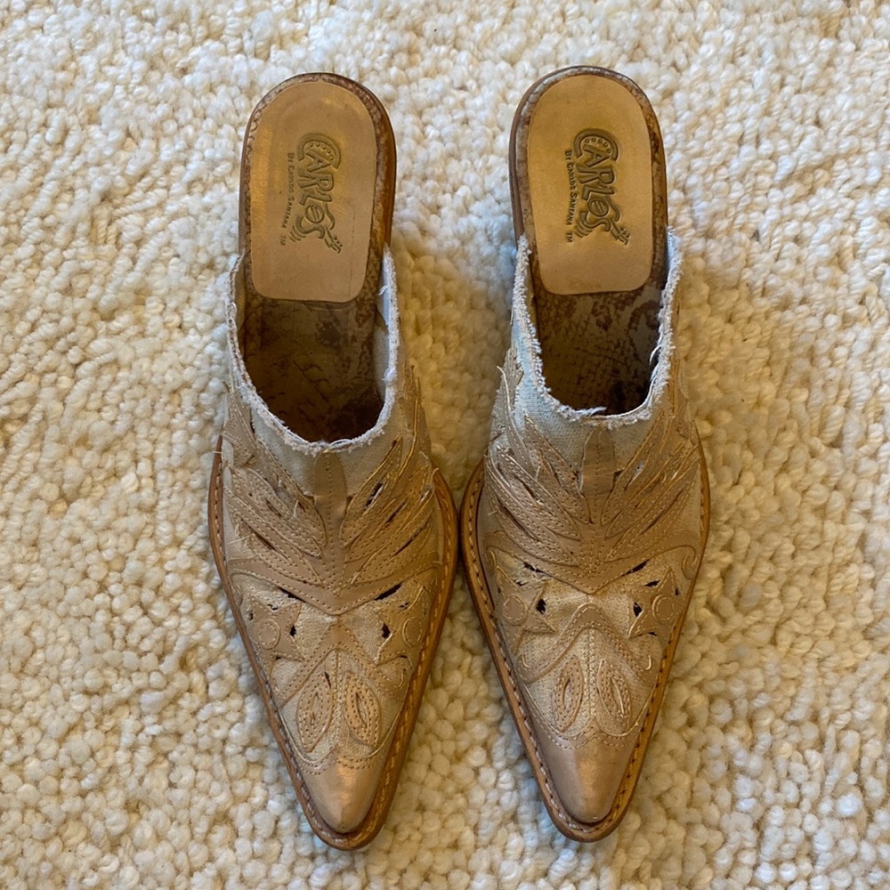 Carlos Santana leather appliqué mules.
